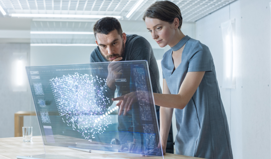 Cette image met en scène des professionnels de la donnée en pleine analyse d’un système d’intelligence artificielle. Elle illustre la dimension technique et humaine du RIA, qui impose des obligations de transparence et de contrôle dans l’usage de l’IA.